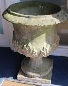 A weathered composition stone garden urn, H.71cm