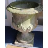 A weathered composition stone garden urn, H.71cm