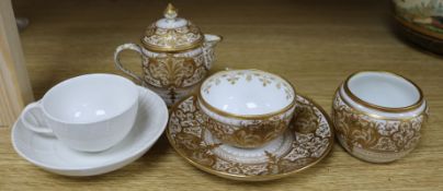 A Berlin KPM raised gilt part coffee set and a plain white coffee cup and saucer