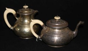 An ivory handled silver teapot and hot water jug by Walker & Hall, London, 1935, gross 59 oz.