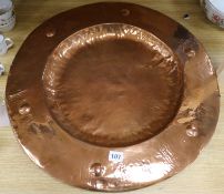 An Arts & Crafts beaten copper charger