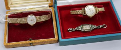 A lady's 9ct gold Longines watch in box, a similar Eterna-matic and a marcasite watch.