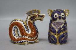 A Royal Crown Derby Koala paperweight, with gold stopper and a similar Dragon paperweight