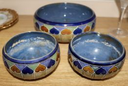 A Royal Doulton 'hearts' bowl and a pair of smaller matching bowls