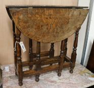 A small oval oak gateleg table, W.59cm