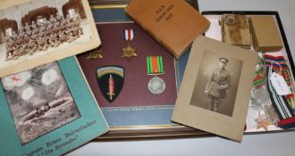 A collection of World War II medals, photos and memorabilia