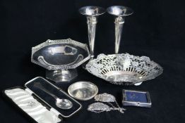 A silver tazze, pair of silver spill vase, a German silver pierced dish and other items.