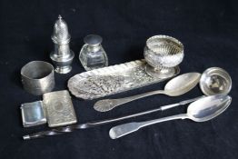 A George III silver toddy ladle, silver caster, pin tray and other items.