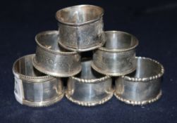 Six various silver serviette rings