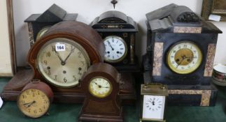 Four French black marble eight day mantel clocks, four other clocks and an aneroid barometer (8)