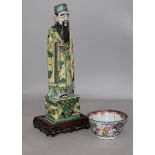 A Chinese famille vert figure and a tea bowl