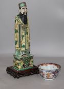 A Chinese famille vert figure and a tea bowl