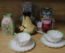 A small group of ceramics, including a pair of Belleek shell-moulded cups and saucers, a Vienna Turn