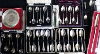 Nine assorted cased sets of silver flatware, mainly spoons.