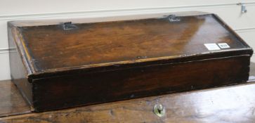 A 17th century pine lap desk, W.69cm