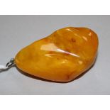 A large yellow amber pendant, 66mm