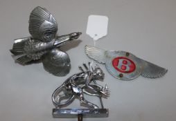 Three chrome car mascots