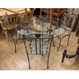 A set of four wrought iron garden chairs with matching glass top table, Diam.122cm