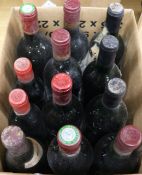 Twenty four assorted red wines including two half bottles of Chateau Rausan-Segla, Margaux, 1984 and