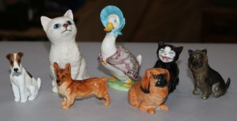 A group of Doulton figures of four dogs and two cats