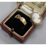 A 9ct gold mounted cameo on 9ct chain, a yellow metal ring and a Cartier box.
