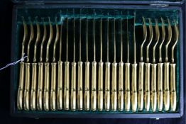 A cased set of twelve pairs of French Christofle gilded dessert eaters.