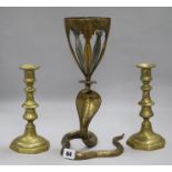 A Benares brass snake vase and a pair of Victorian brass candlesticks