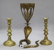 A Benares brass snake vase and a pair of Victorian brass candlesticks