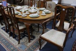 A 1930's teak dining table, with a set of six Queen Anne style beech dining chairs, 200 x 120cm