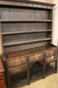 A George III oak dresser, W.147cm H.194cm