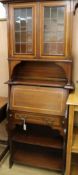 An Edwardian satinwood banded mahogany student's desk with bookcase top, W.74cm H.186cm