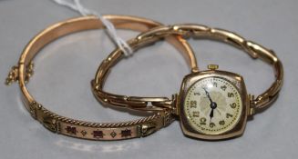 A Victorian gold and gem set hinged bangle and a lady's 9ct gold wrist watch.