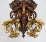 A pair of giltwood wall brackets and a walnut wall bracket