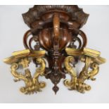 A pair of giltwood wall brackets and a walnut wall bracket