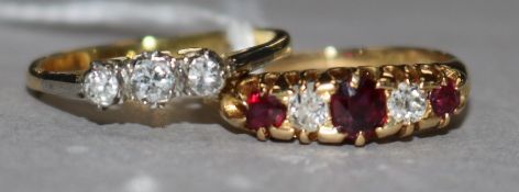 A three-stone diamond ring, 18ct gold shank and an 18ct gold, ruby and diamond half-hoop ring