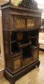 A Japanese carved and stained pine side cabinet with open shelving and lacquered Shibayama doors (