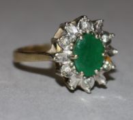 A 9ct gold, emerald and diamond cluster ring