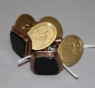A pair of 18ct gold cufflinks and a pair of 9ct gold and black onyx set cufflinks.