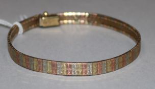 A 9ct three-colour gold flexible link bracelet, 11.3gr