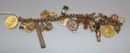 A 14ct gold charm bracelet hung with twenty two assorted gold charms including sovereign and half