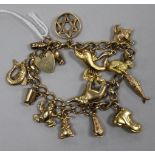 A 9ct gold charm bracelet with padlock clasp, hung with 14 charms, one 18K gold, set with a small