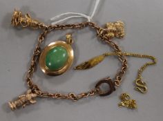 A 9ct gold charm bracelet hung with three charms, a pendant and bracelet(a.f.).