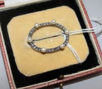 An early 20th century gold and silver, rose cut diamond and cultured pearl set open circular brooch,