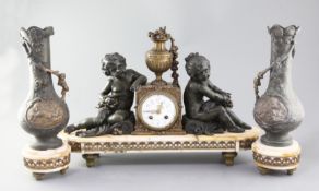 A French Art Nouveau bronzed spelter and marble three piece clock garniture, clock 20in.