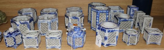 Twenty one Chinese blue and white pierced pot pourri vases and candle holders (various shapes and