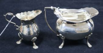A silver shaped rectangular cream jug and a small silver baluster-shaped cream jug, 11.3oz approx