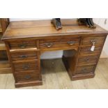 An Edwardian walnut kneehole desk, W.123cm