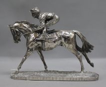 A silver dipped horse and jockey