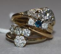 Three 18ct gold and diamond rings and an 18ct gold sapphire and diamond ring.