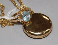 A 9ct gold, topaz and diamond-set ring and a circular yellow metal enclosed locket on 9ct gold